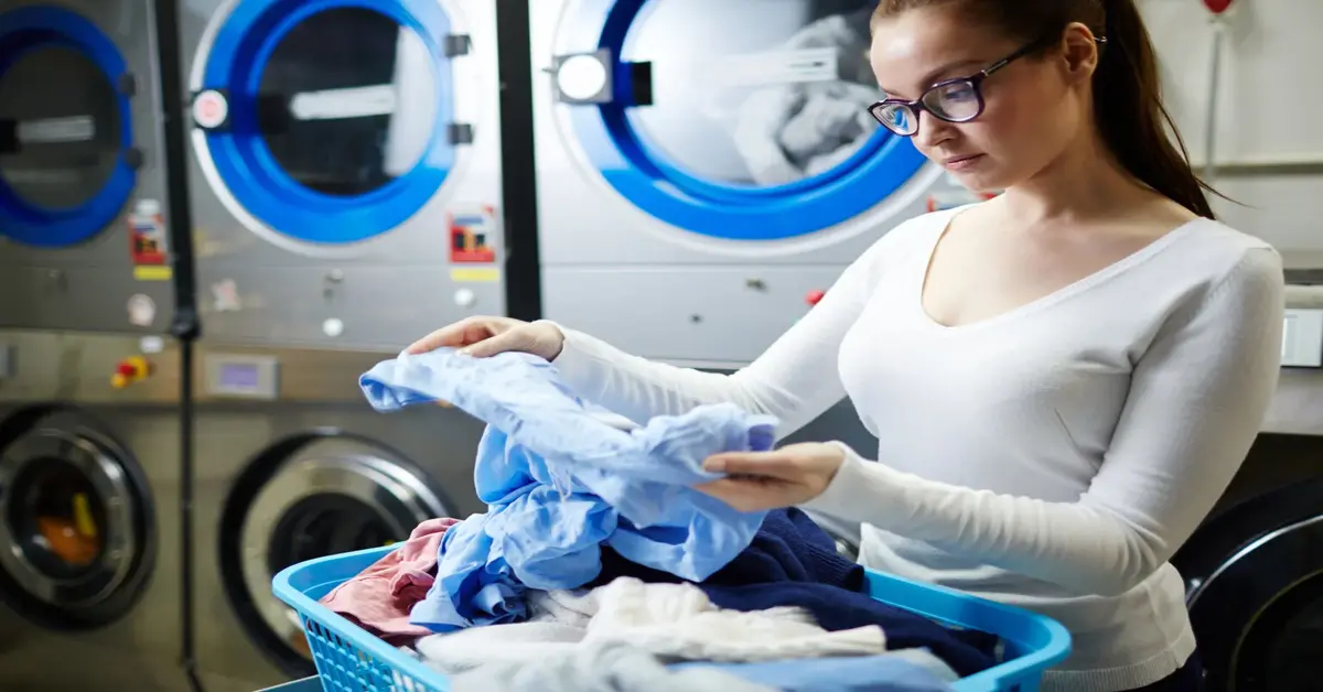 A modern facility offering 24-Hour Laundry Services in the USA, featuring clean washing machines, bright lighting, and customers doing laundry at night, showcasing convenience and accessibility